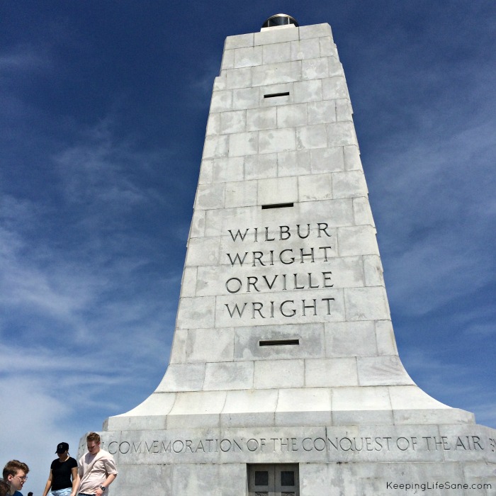 Monument at the Wright Brothers Memorial.  Tall and White whith blue sky