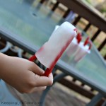 hand holding fun summer popsicles with Twizzlers