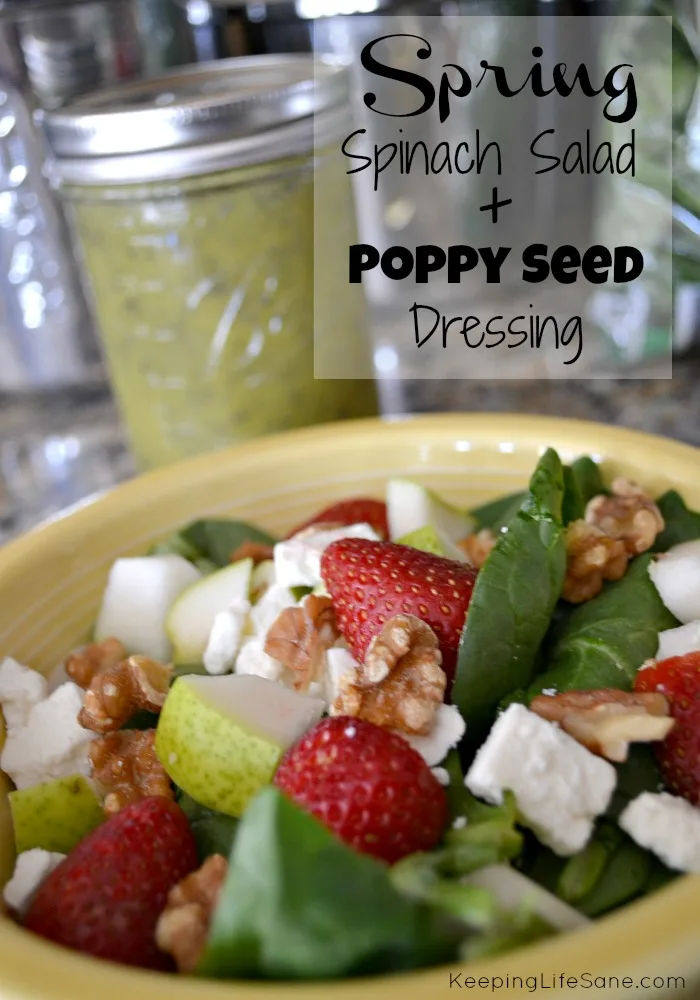 yellow bowl with spinach salad with homemade poppy seed salad dressing