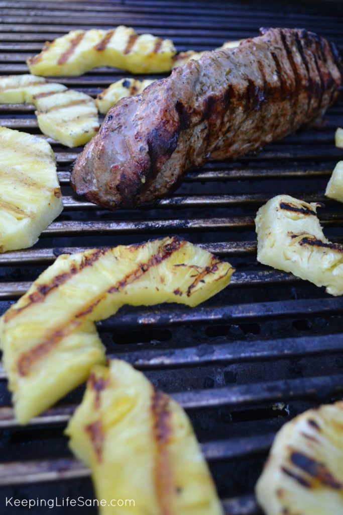 pork on grill with pineapple slices with grill marks