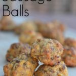 sausage balls with cheese on a cutting board