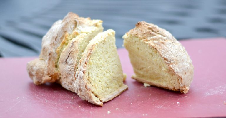 sliced Irish soda bread on red mat