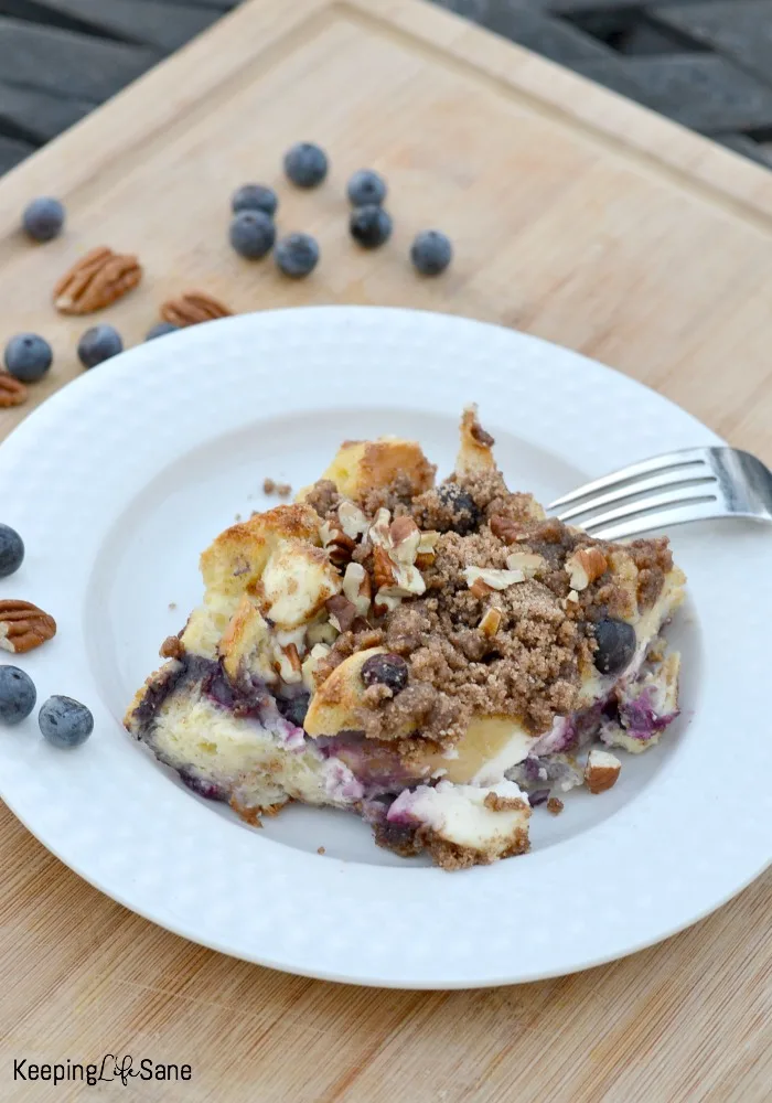 white bowl on cutting board with blueberry stuffed French toast recipe