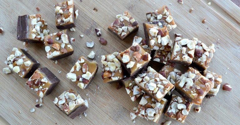 overhead view of chocolate hazelnut caramel fudge on cutting board.