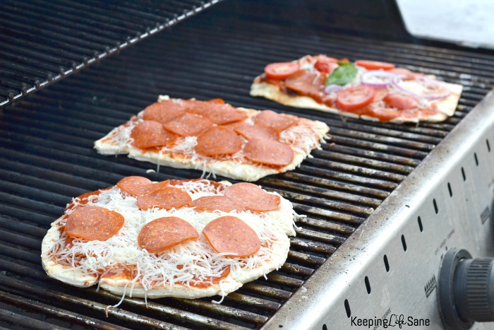 3 pizzas on outside grill