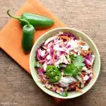 This tex mex coleslaw is perfect for any potluck or cookout. It's easy to throw together and tastes even better the next day.