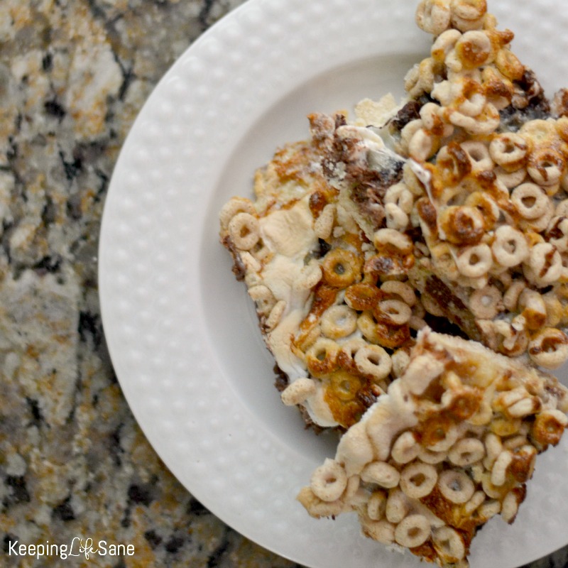 overhead view cheerio cereal bars on white plate sitting on kitchen counter