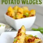 White square plate with 2 potato wedge with cheese and bacon and a few green onions