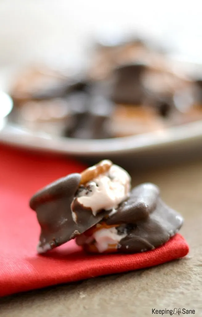 ice cream bites with pretzels and dipped on chocolate red napkin