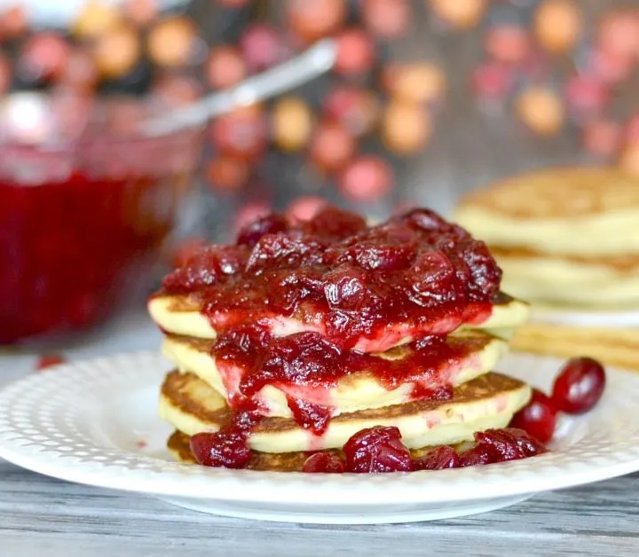 Stack of pancakes with cranberry sauce on top