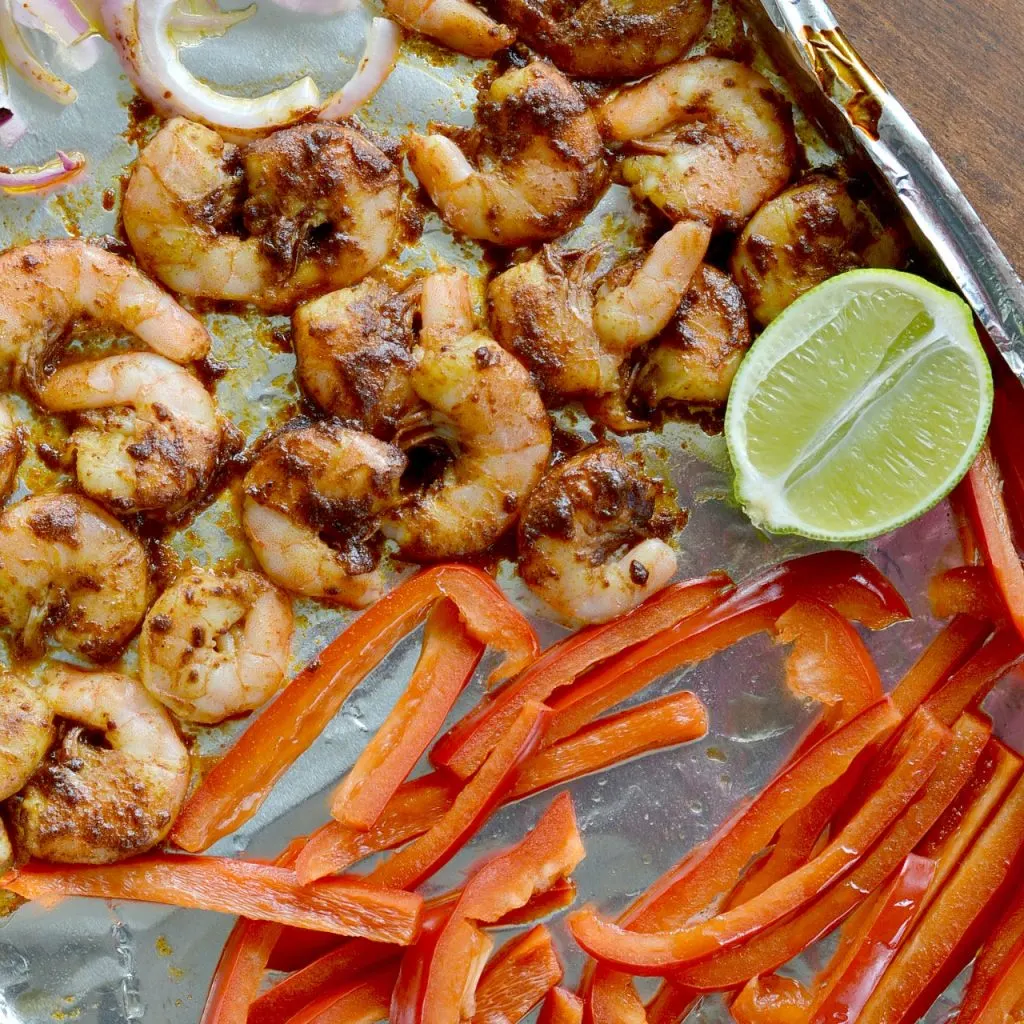 What a perfect meal to make on a busy week night. These one pan shrimp fajitas are so delicious! It's such an easy recipe!