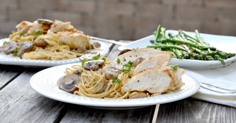 chicken, pasta and mushrooms on white plate