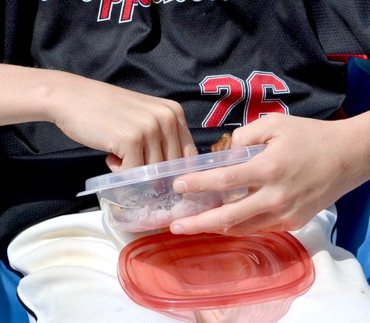 baseball player holding portable protein packs