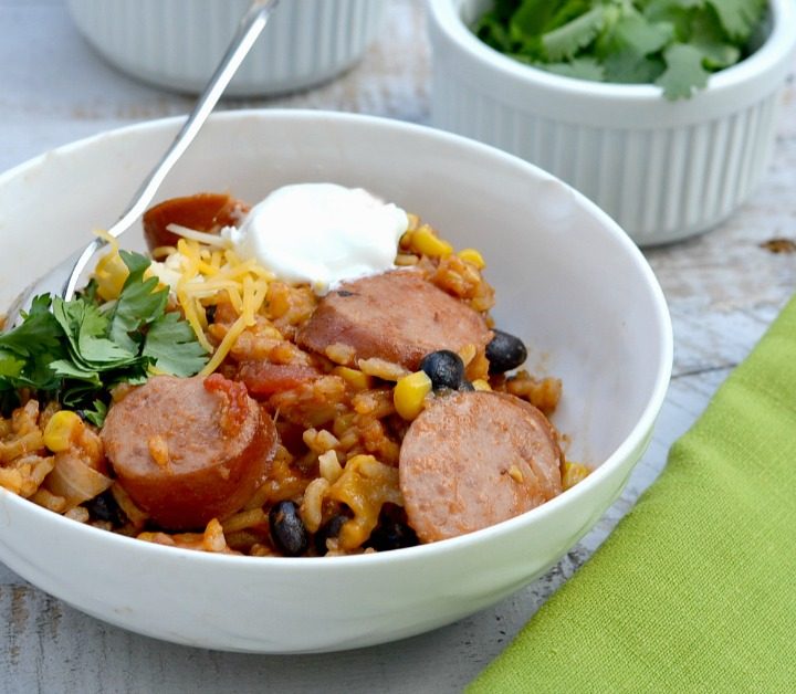 Mexican sausage recipe in white bowl with green napkin