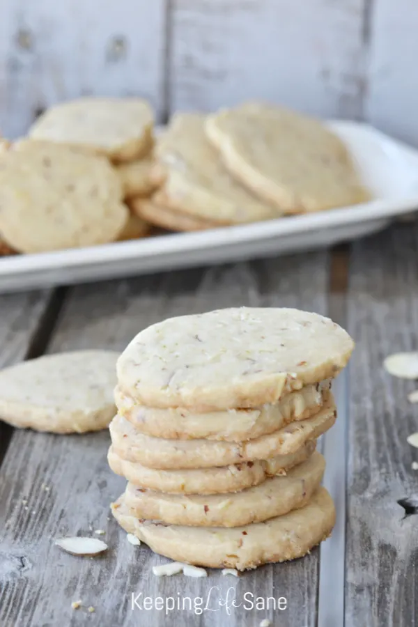 stack of eggless almond cookies on wooden table