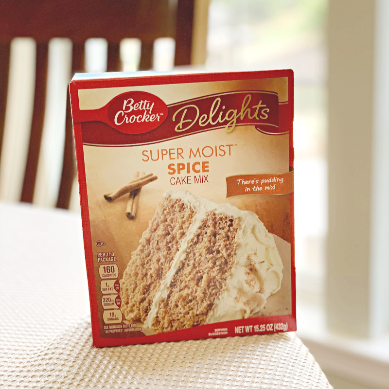 book of super moist spice cake mix by Betty Crocker on table