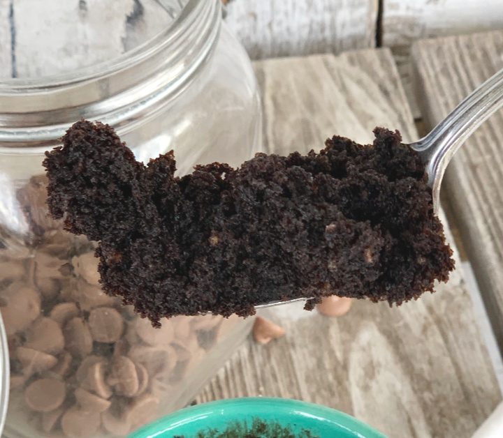closeup of eggless chocolate mug cake on fork