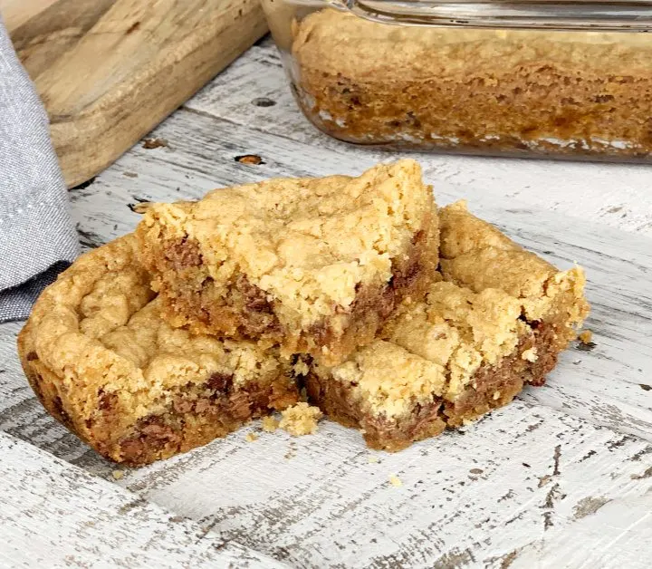 These eggless chocolate chip cookie bars are a family favorite. This easy dessert won't last long. Who doesn't like soft and chewy cookie bars?