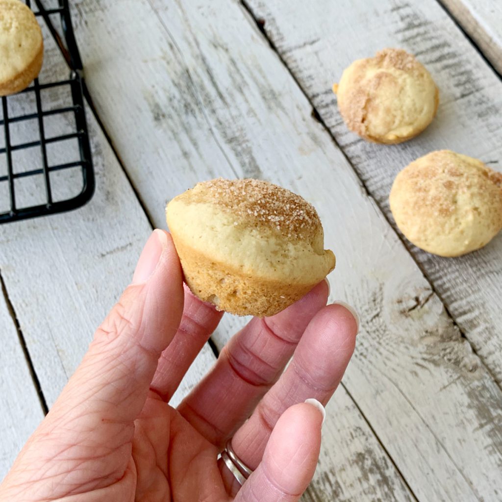 hand holding a mini applesauce muffin