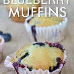 closeup view of No Egg blueberry muffin on a wooden cutting board