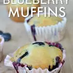 closeup view of No Egg blueberry muffin on a wooden cutting board