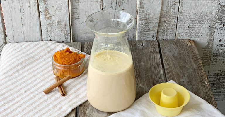 small bowl of pumpkin puree, bottle of creamer with yellow lid to the side