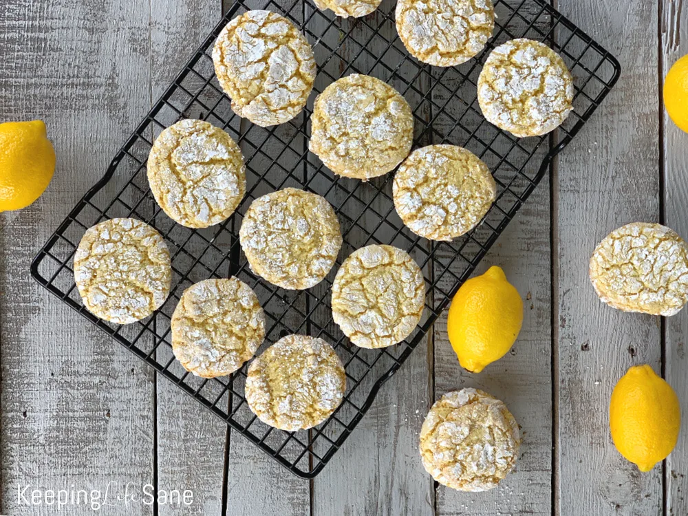 lemon cookies on black wire rack with overhead view