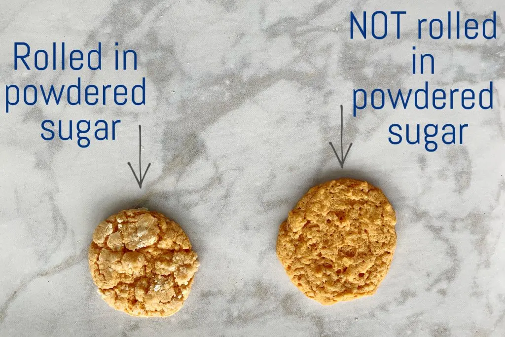 2 orange cookies from cake mix on marble counter top