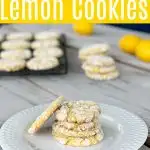 white plate with 4 lemon cookies and one propped up on the side