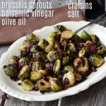 white bowl with brussel sprouts with dried cranberries