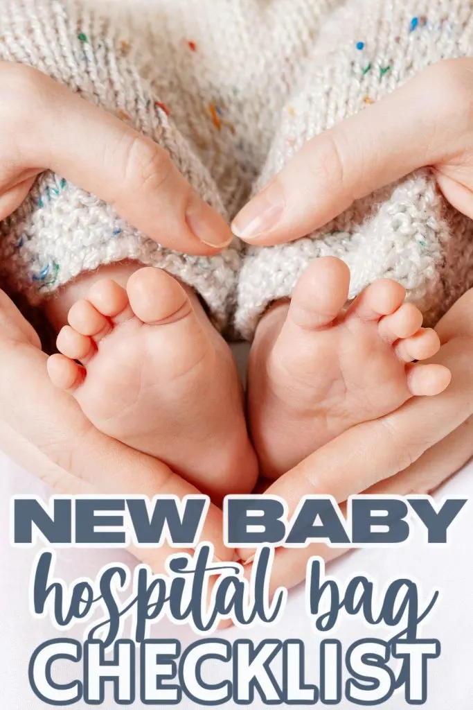 Tiny Newborn Baby's feet on female Heart Shaped hands closeup