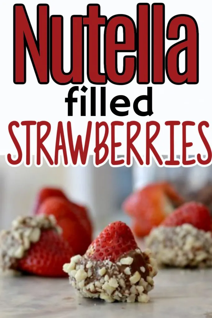 red strawberries filled with nutella with chocolate and nut coating on counter