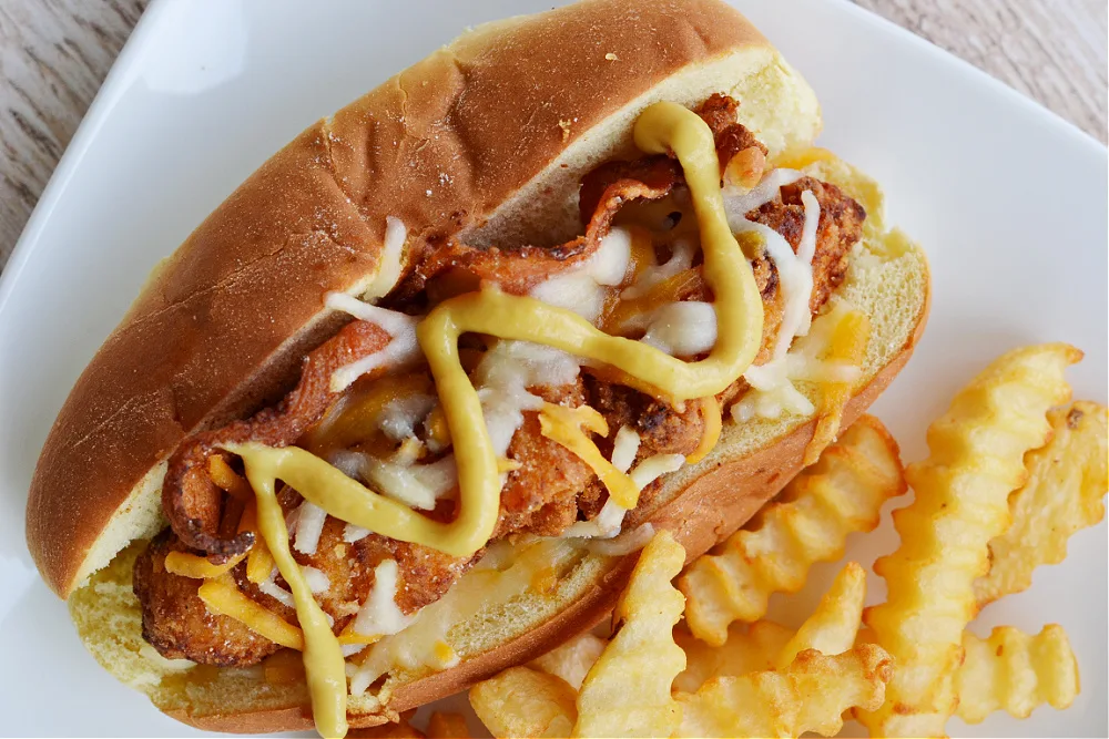 closeup overhead view of South Carolina bird dog recipe with french fries on a white plate