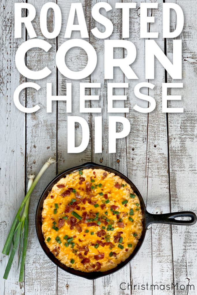 overhead view of corn dip with cream cheese, bacon and green onions in cast iron skillet