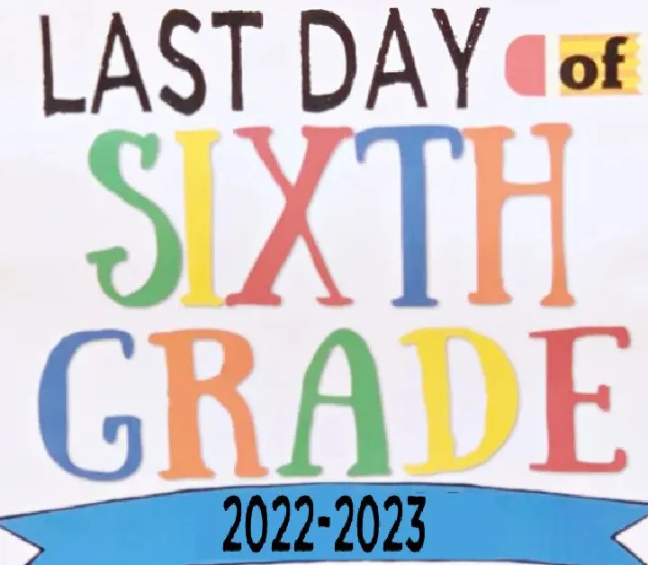 girl holding cute last day of school sign 2022-2023