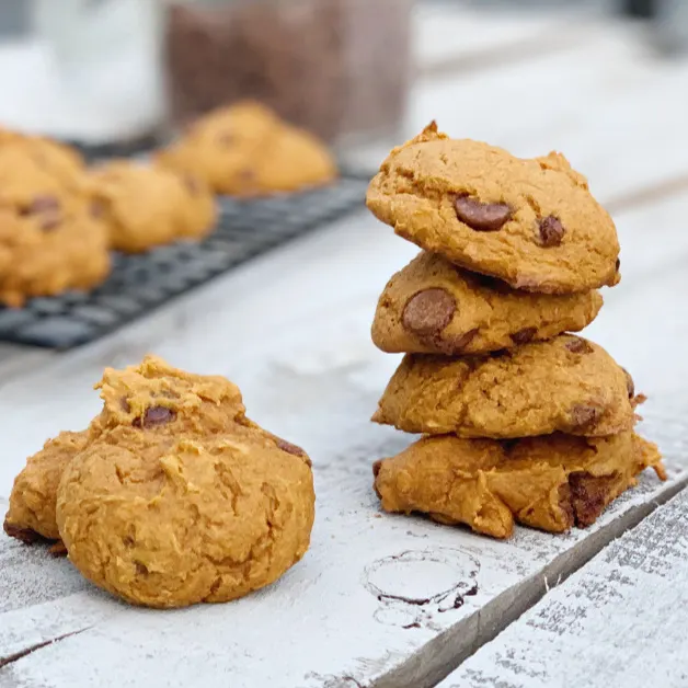 stack of 3 ingredient pumpkin cookies on wooden table