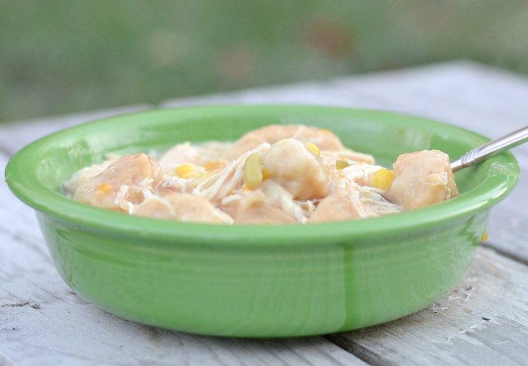 Easy crock pot chicken and dumplings in a green bowl