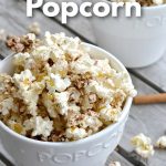 white popcorn bowl with cinnamon popcorn overflowing