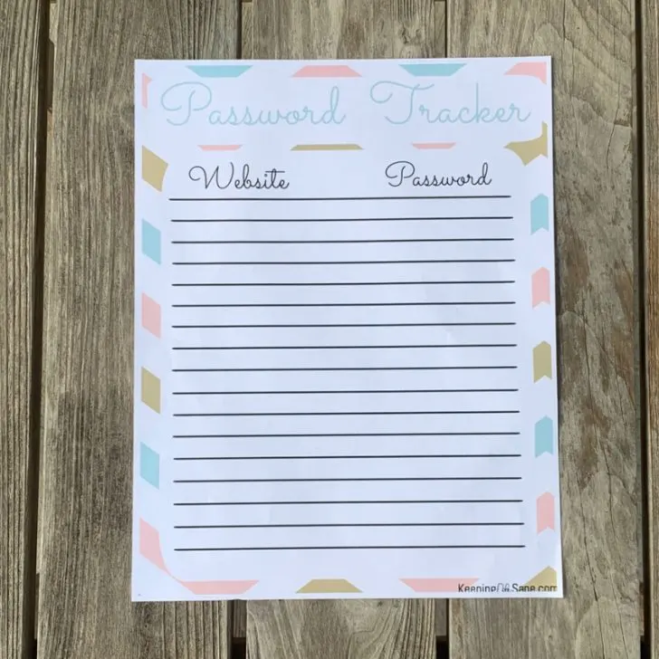 printout of lined password tracker on wooden table