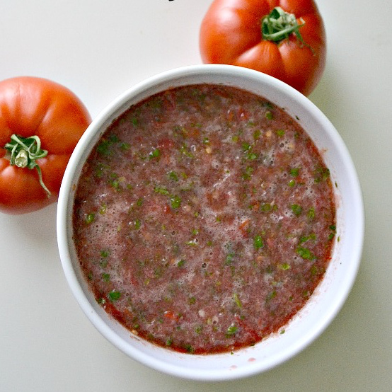 white bowl with homemade salsa made with fresh tomatoes