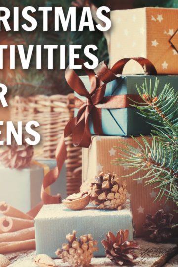 pastel christmas packages with pine needs and pinecones